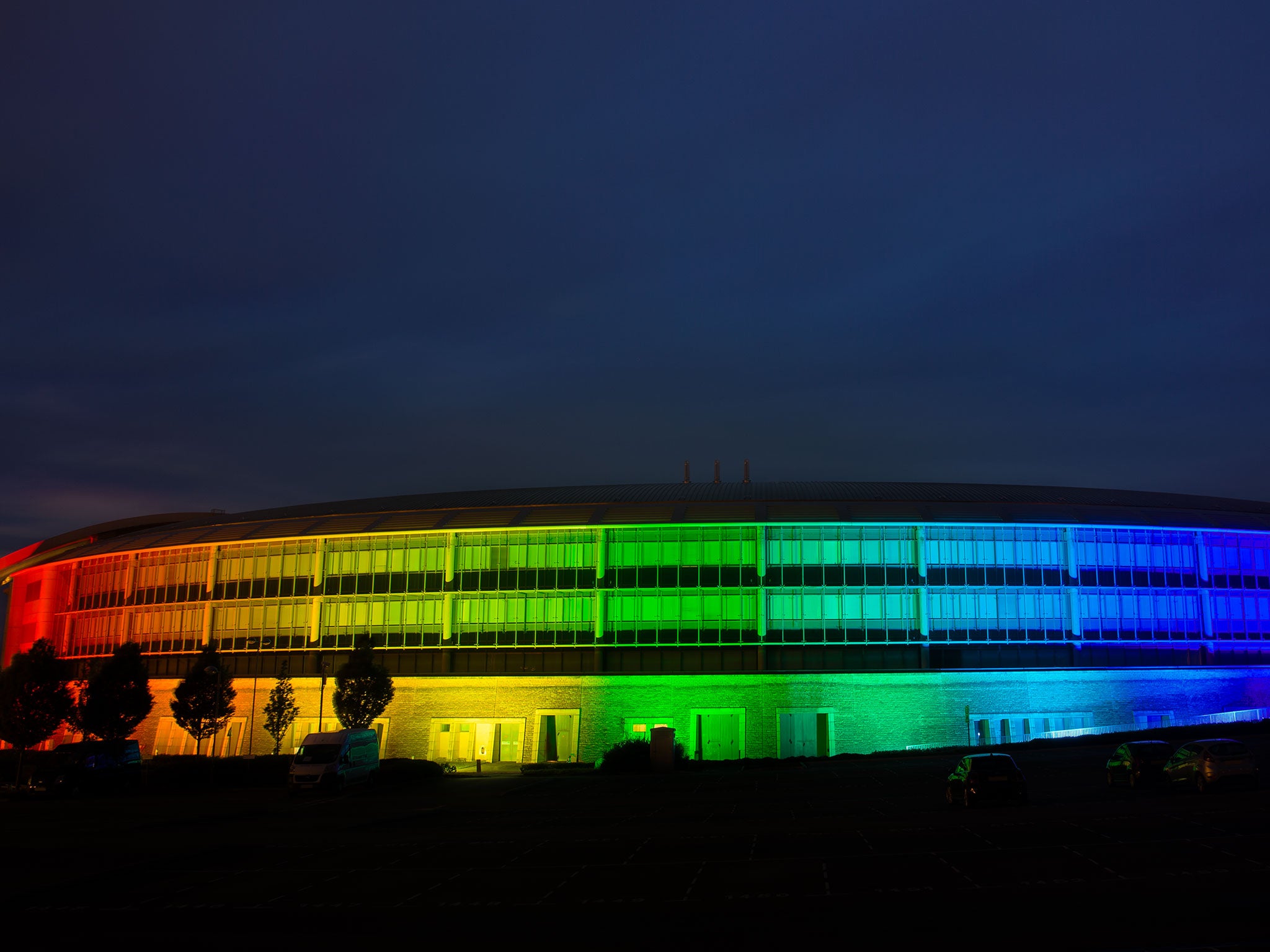 GCHQ projects the colours of the rainbow onto its famous 'doughnut' headquarters