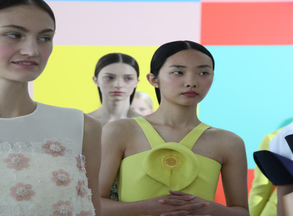 Models and signs backstage at Delpozo s/s’15