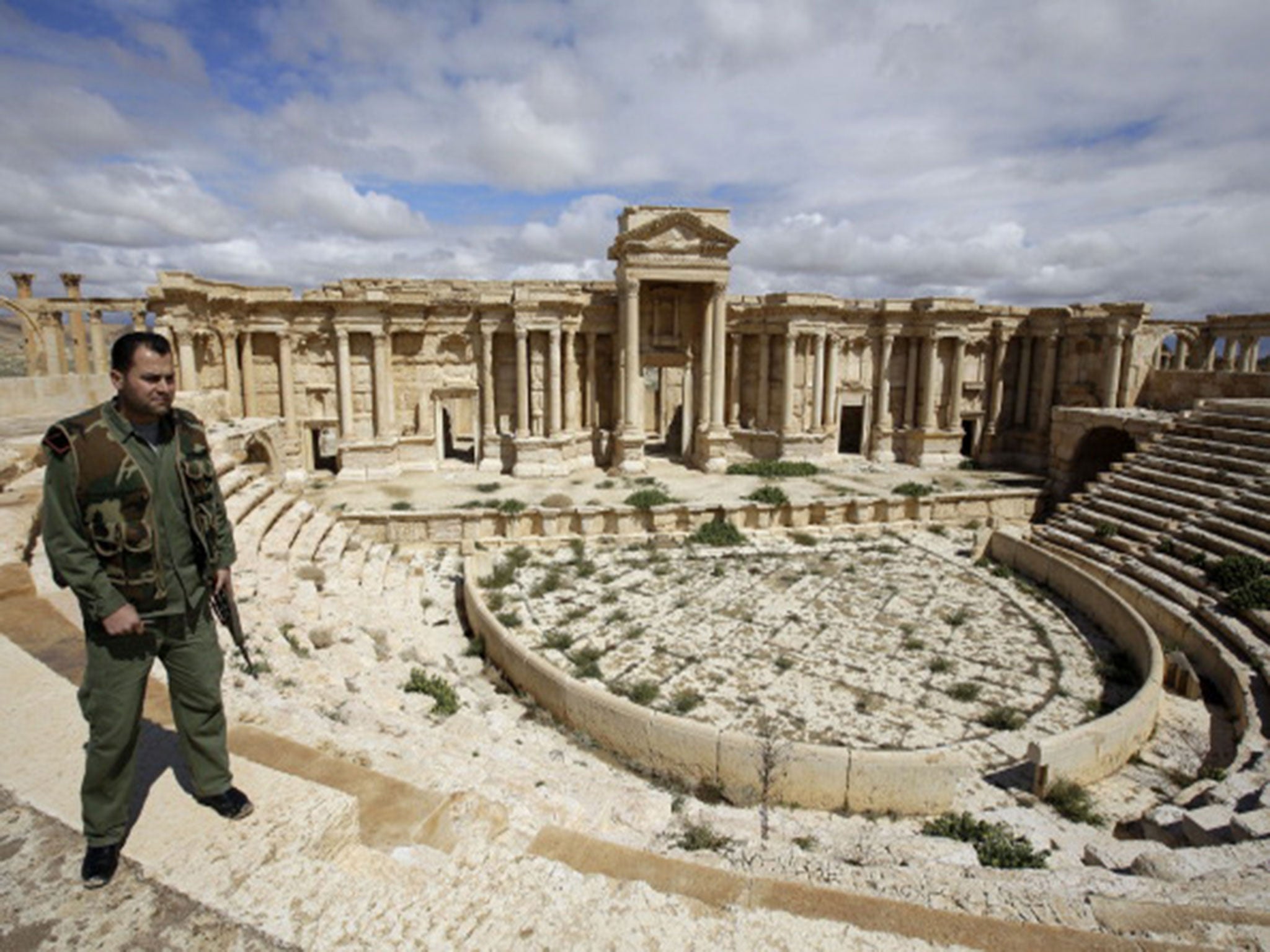 A Syrian policeman patrolling the ancient oasis city of Palmyra