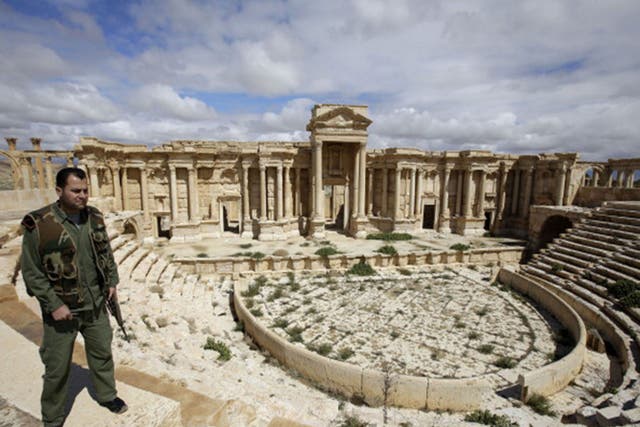 A Syrian policeman patrolling the ancient oasis city of Palmyra