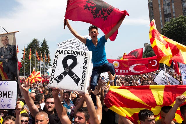 Protesters in Skopje wave Albanian and Macedonian flags