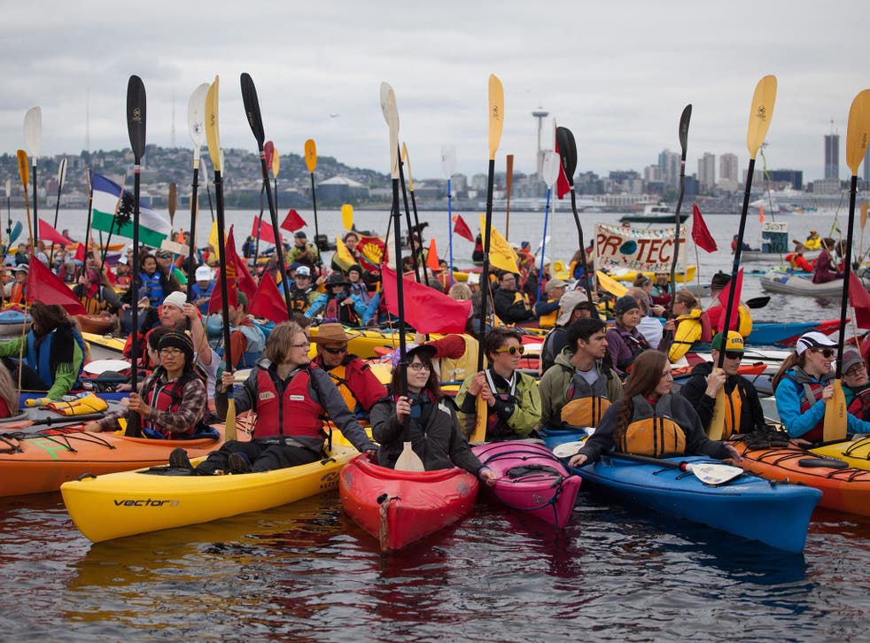 Activists gather during the ‘sHellNo Kayak Flotilla’ around Royal Dutch Shell’s ‘Polar Pioneer’, docked at the Port of Seattle along the Puget Sound