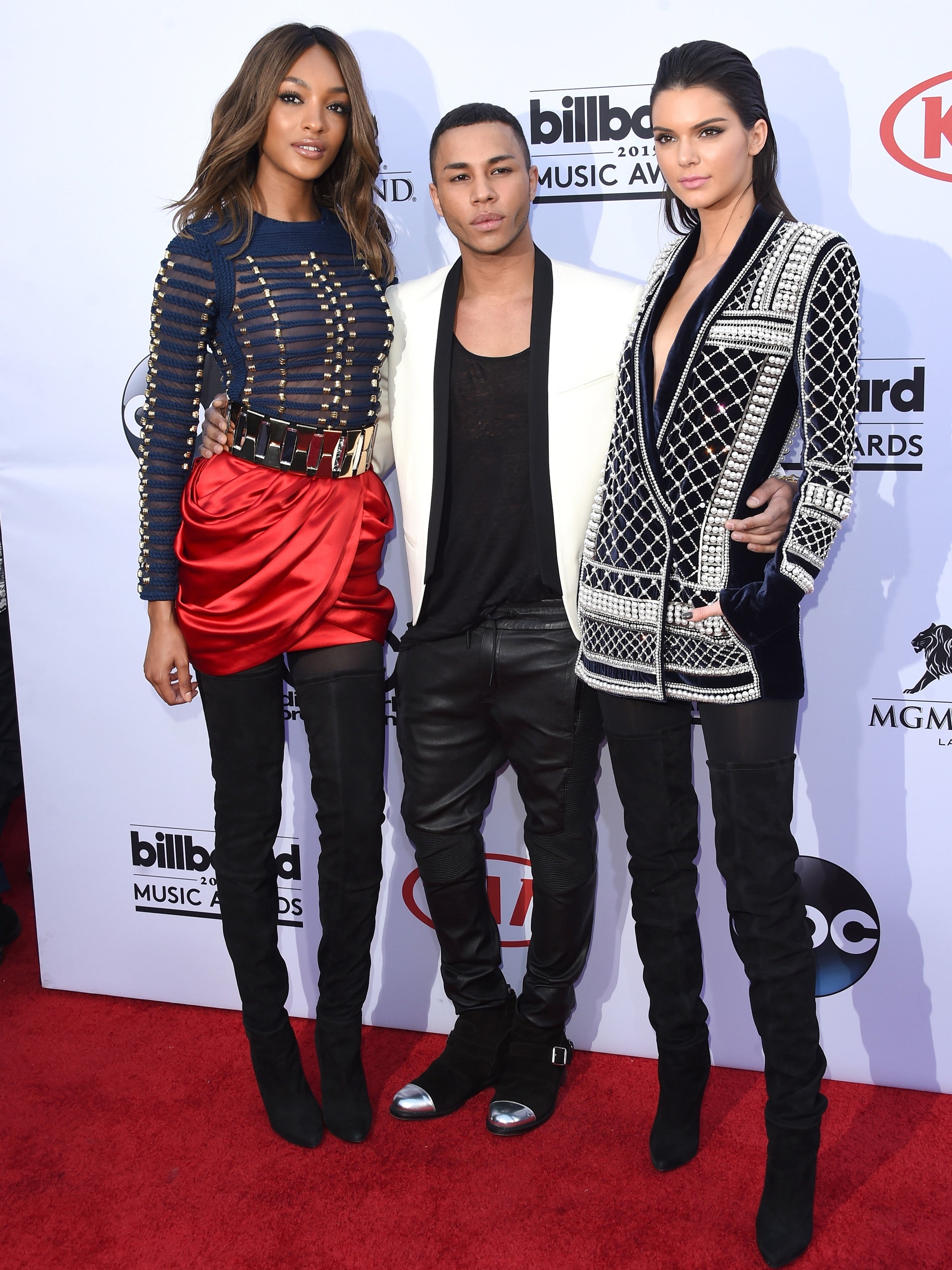 Jourdan Dunn and Kendall Jenner with Olivier Rousteing wearing designers from the upcoming collaboration