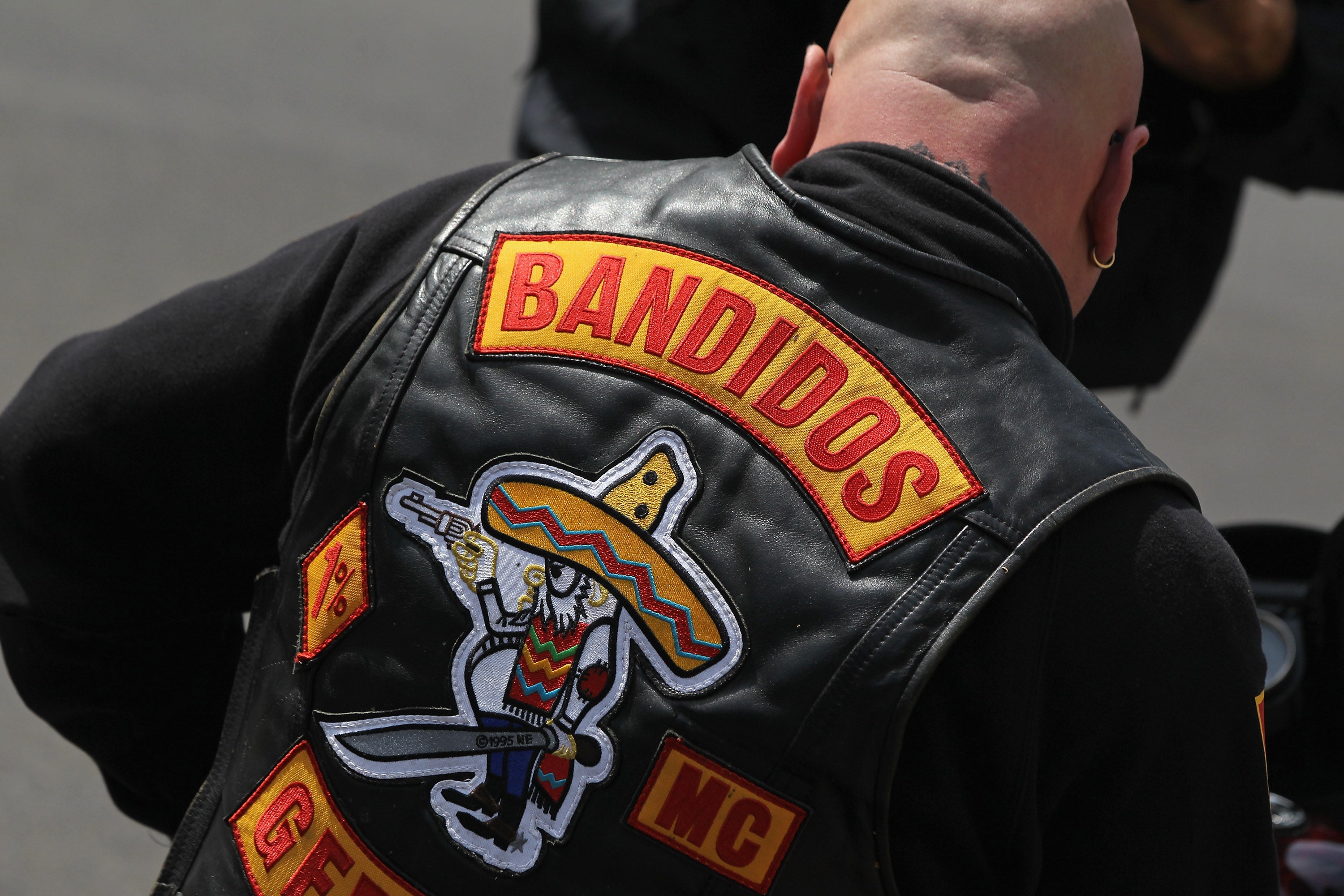 A Bandidos gang member sits on his motorcycle outside a Berlin club in 2011