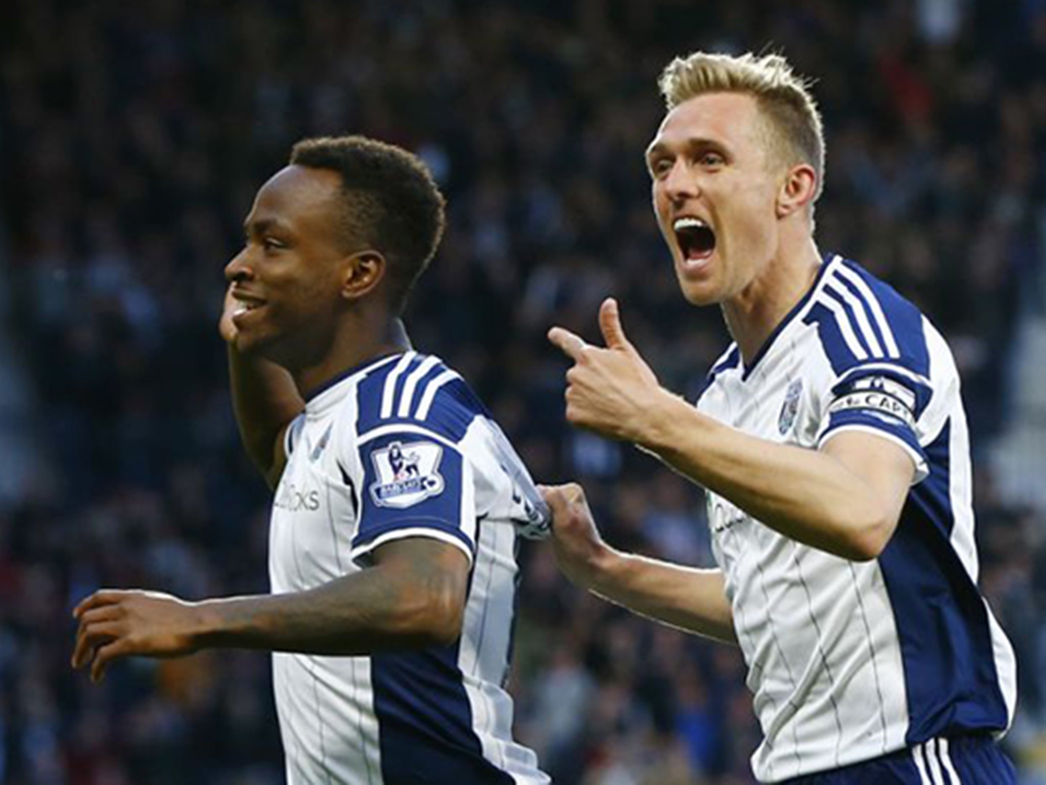 West Bromwich’s captain, Darren Fletcher, right, leads the applause for Saido Berahino’s opening goal against Chelsea last night