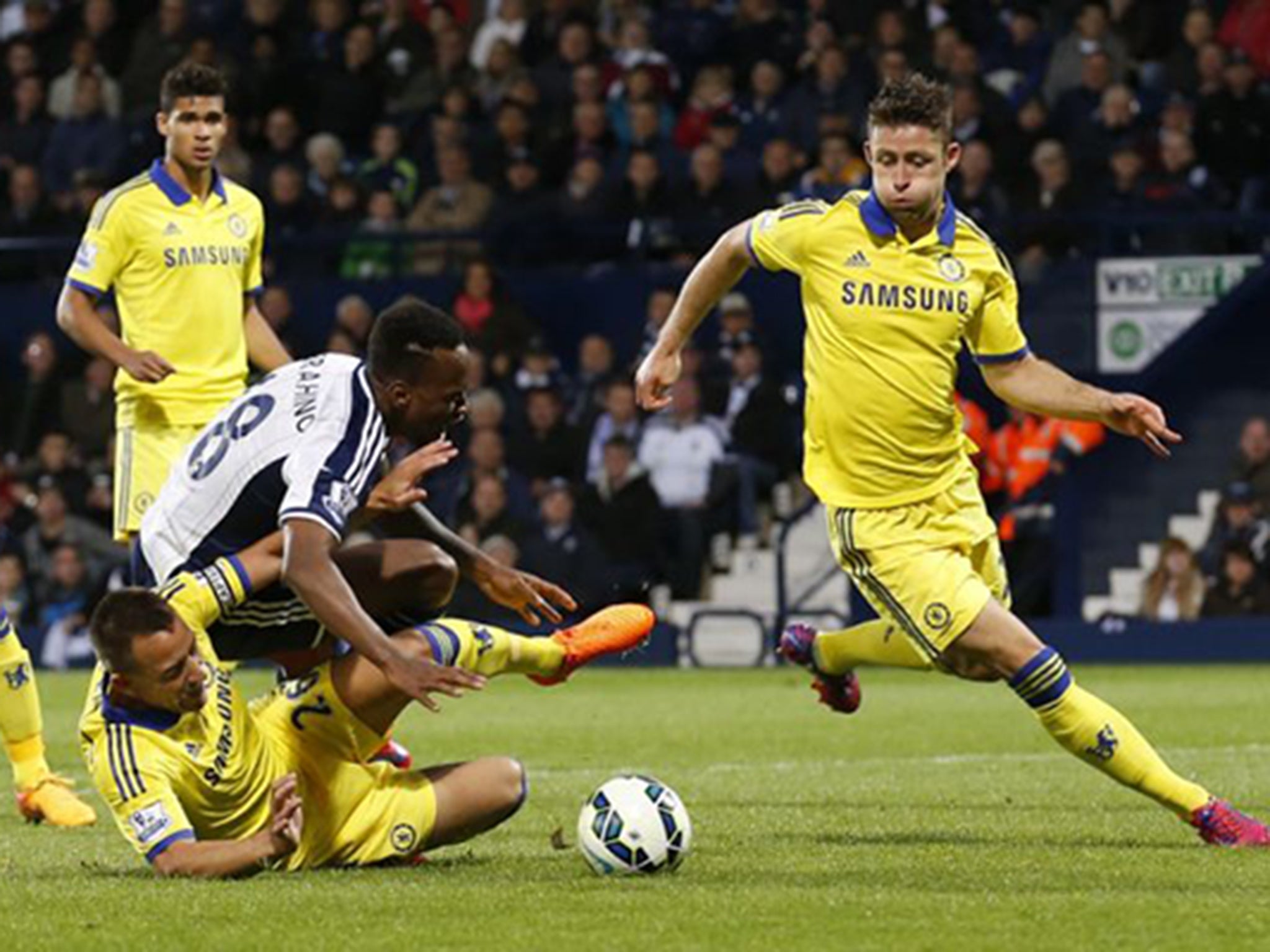 John Terry brings down Berahino for a penalty early in the second half