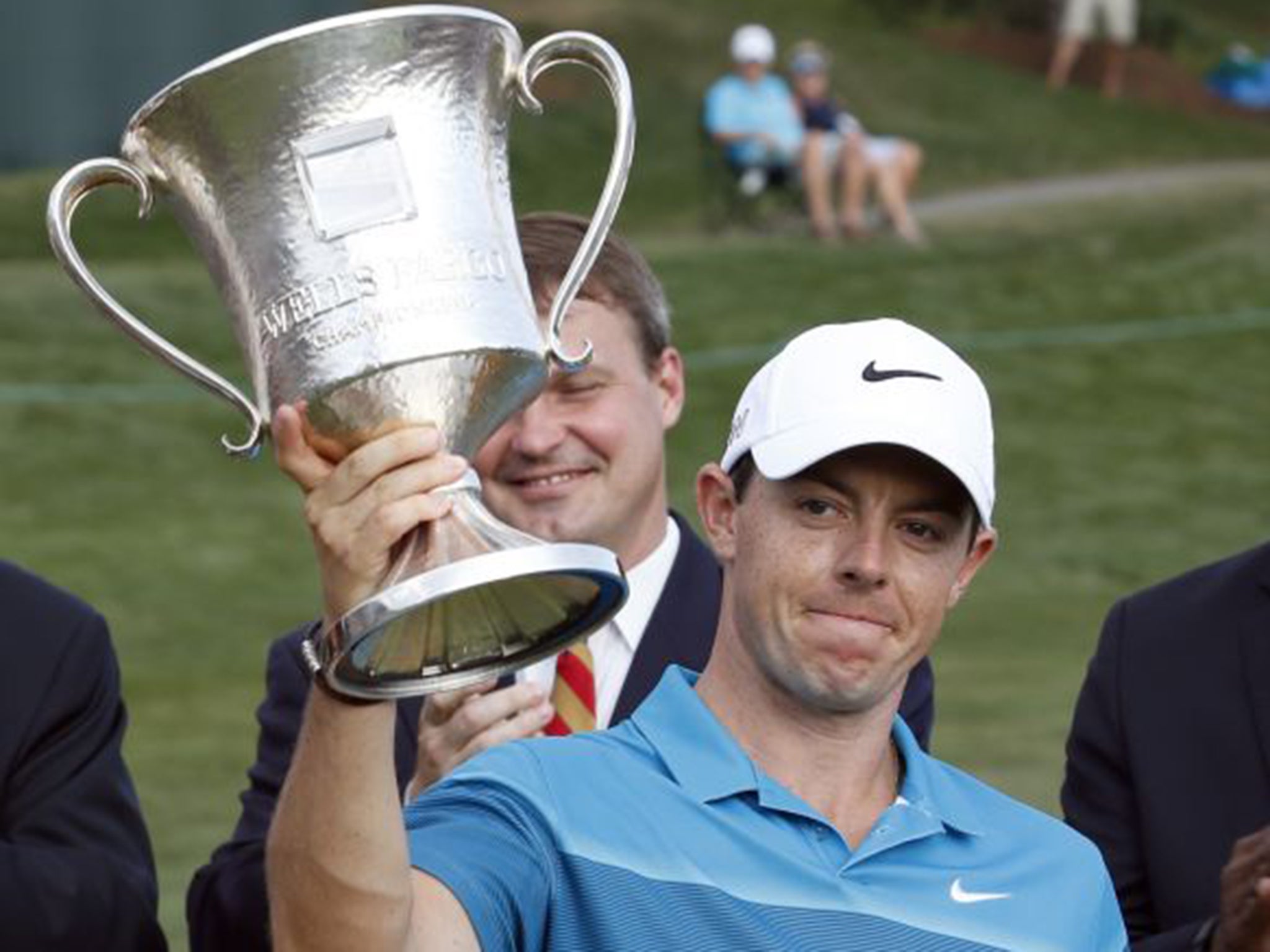 Rory McIlroy shows off the Wells Fargo Trophy, which he won by seven strokes at Quail Hollow on Sunday