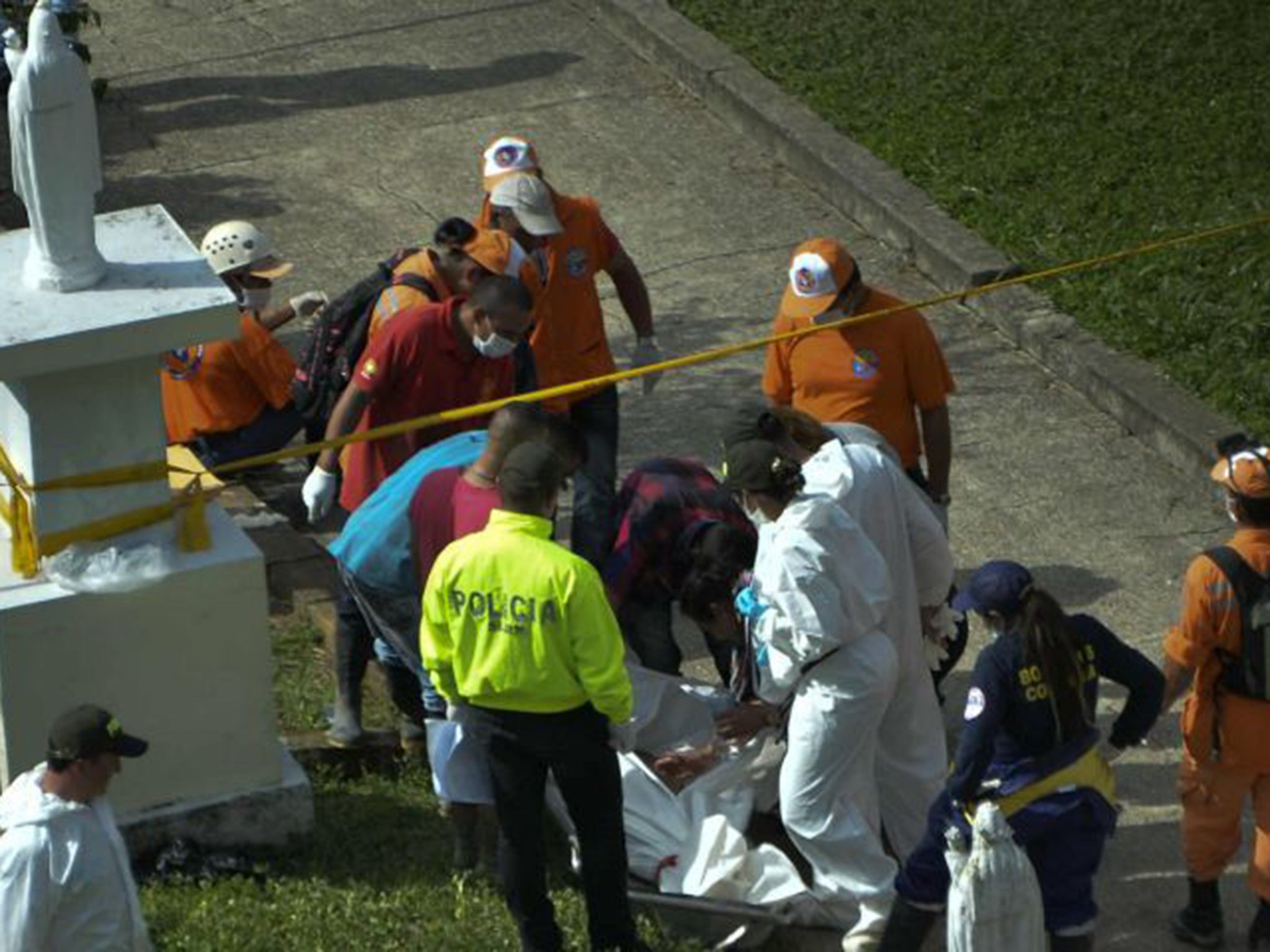 At least 52 people were killed and dozens injured when the flash flood and mudslide swept through the town