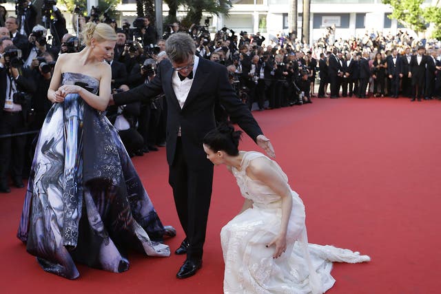 Cate Blanchett and director Todd Haynes turn to help Rooney Mara upon arrival for the screening of the film Carol at the Cannes Film Festival, 17 May 2015