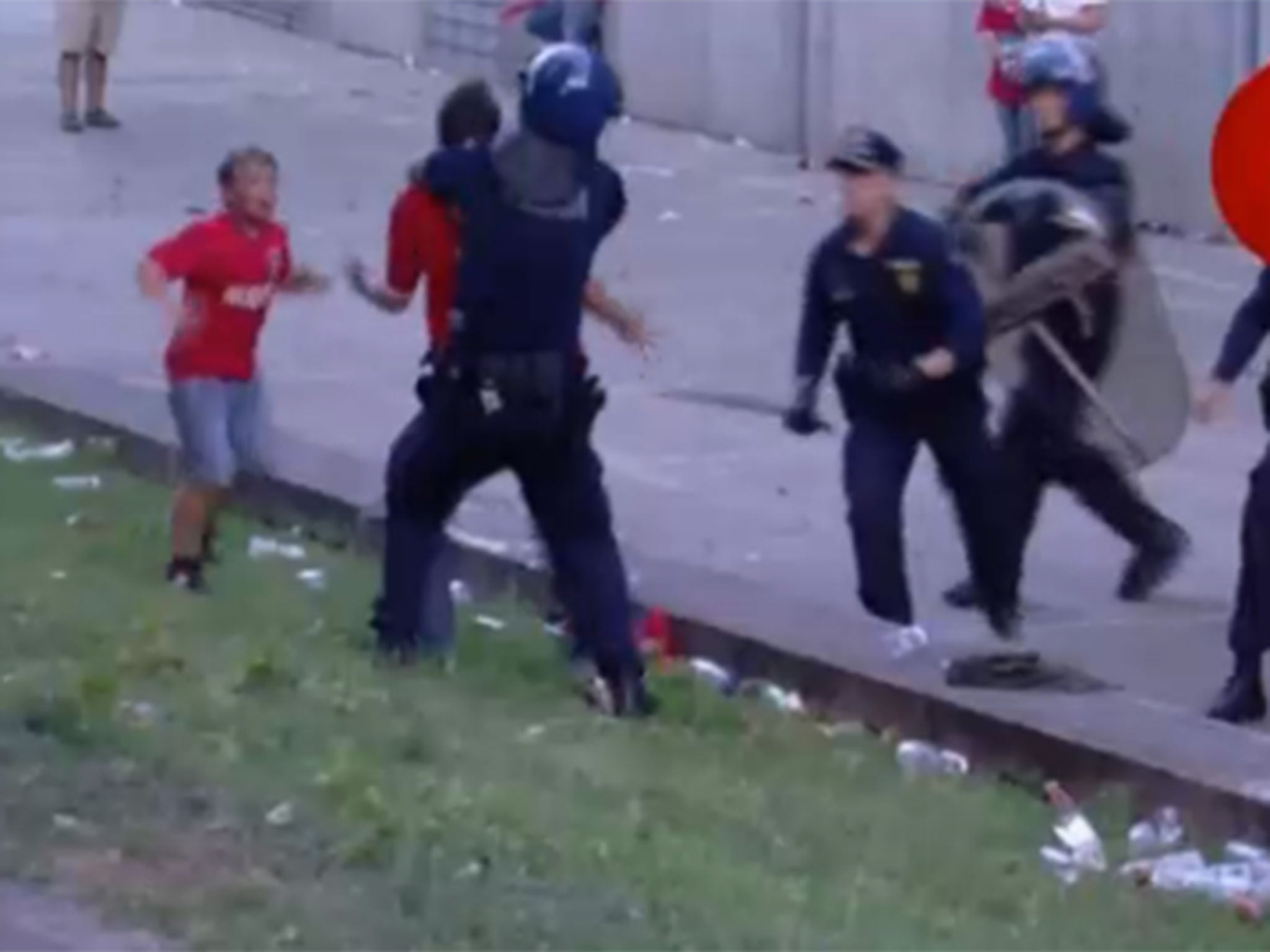 Police beat the father in front of his kids as he walked back from the the match that secured the Portuguese title for Benfica
