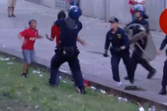 Police beat the father in front of his kids as he walked back from the the match that secured the Portuguese title for Benfica