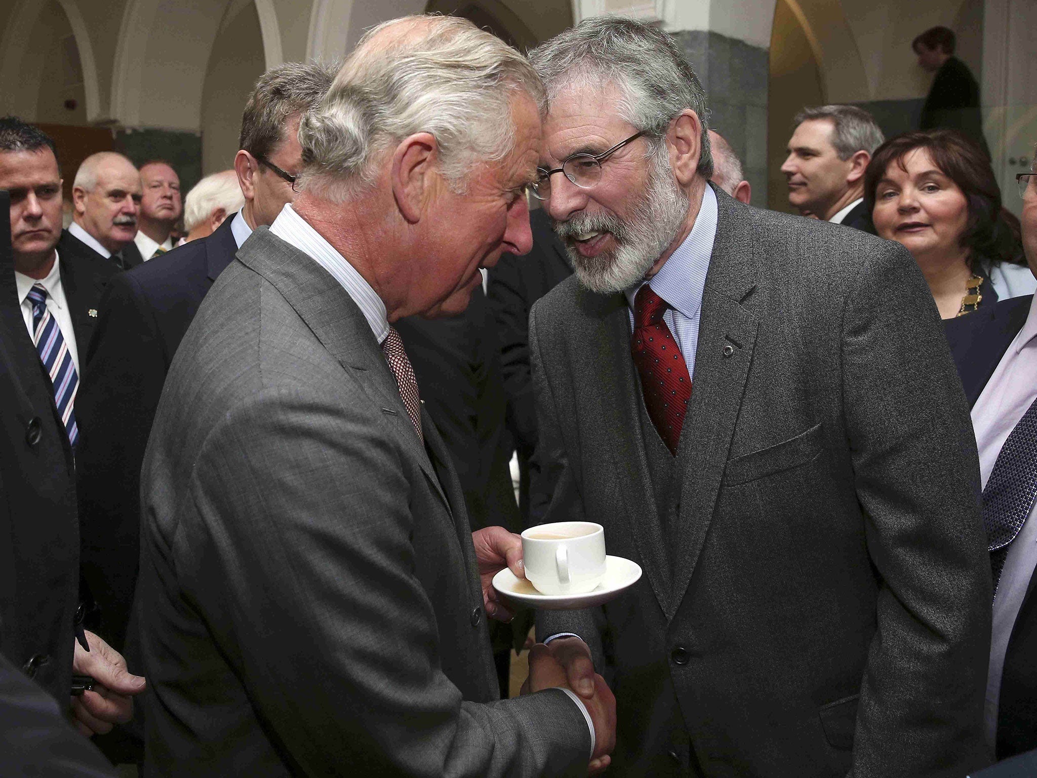 Britain's Prince Charles (L) shakes hands with Gerry Adams at the National University of Ireland in Galway, Ireland May 19, 2015.