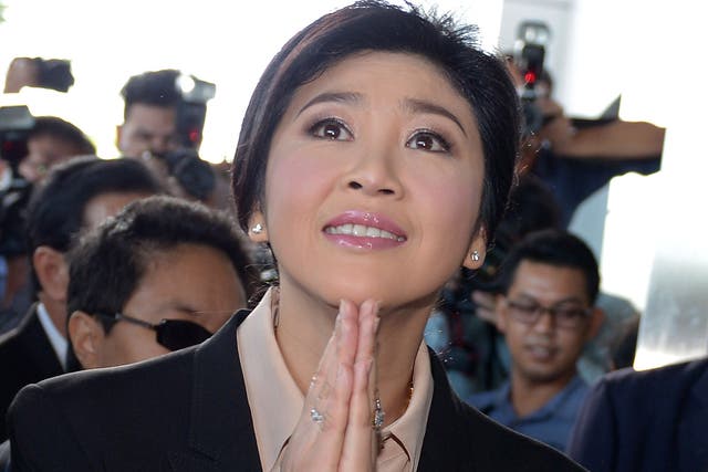Thailand’s former premier Yingluck Shinawatra arrives at the Supreme Court in Bangkok on Tuesday. She remains hugely popular in rural heartlands in the north, but is reviled by the political establishment