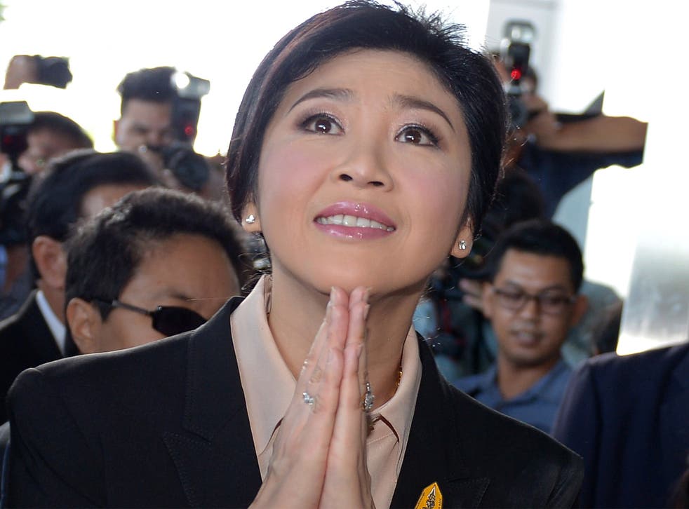 Thailand’s former premier Yingluck Shinawatra arrives at the Supreme Court in Bangkok on Tuesday. She remains hugely popular in rural heartlands in the north, but is reviled by the political establishment