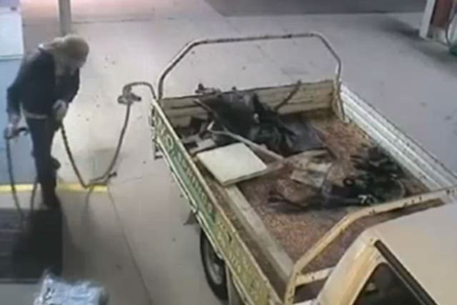The bungling thief tried to steal the ATM from the petrol station