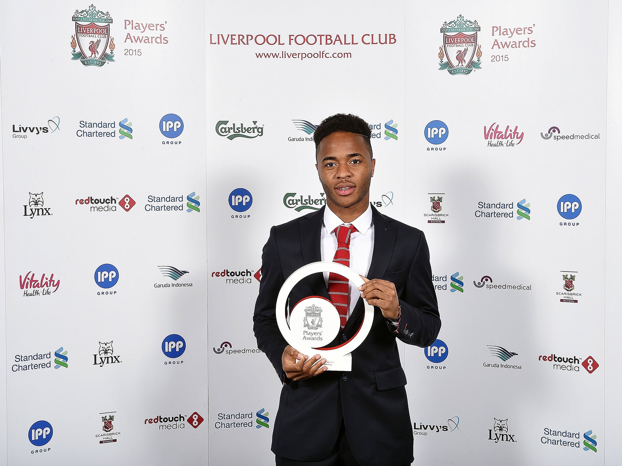 Raheem Sterling pictured with his Liverpool Young Player of the Year award