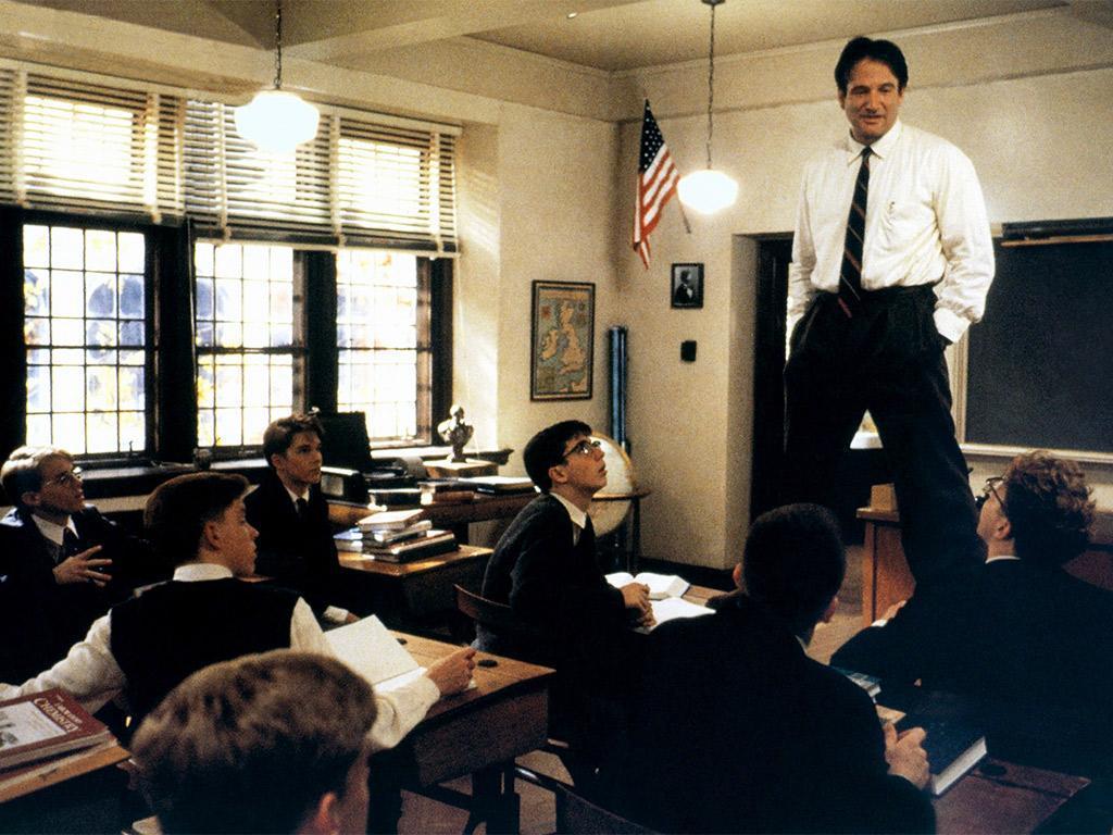 'Oh me! Oh life!': Robin Williams plays maverick teacher John Keating, who uses poetry to inspire his students to follow their dreams