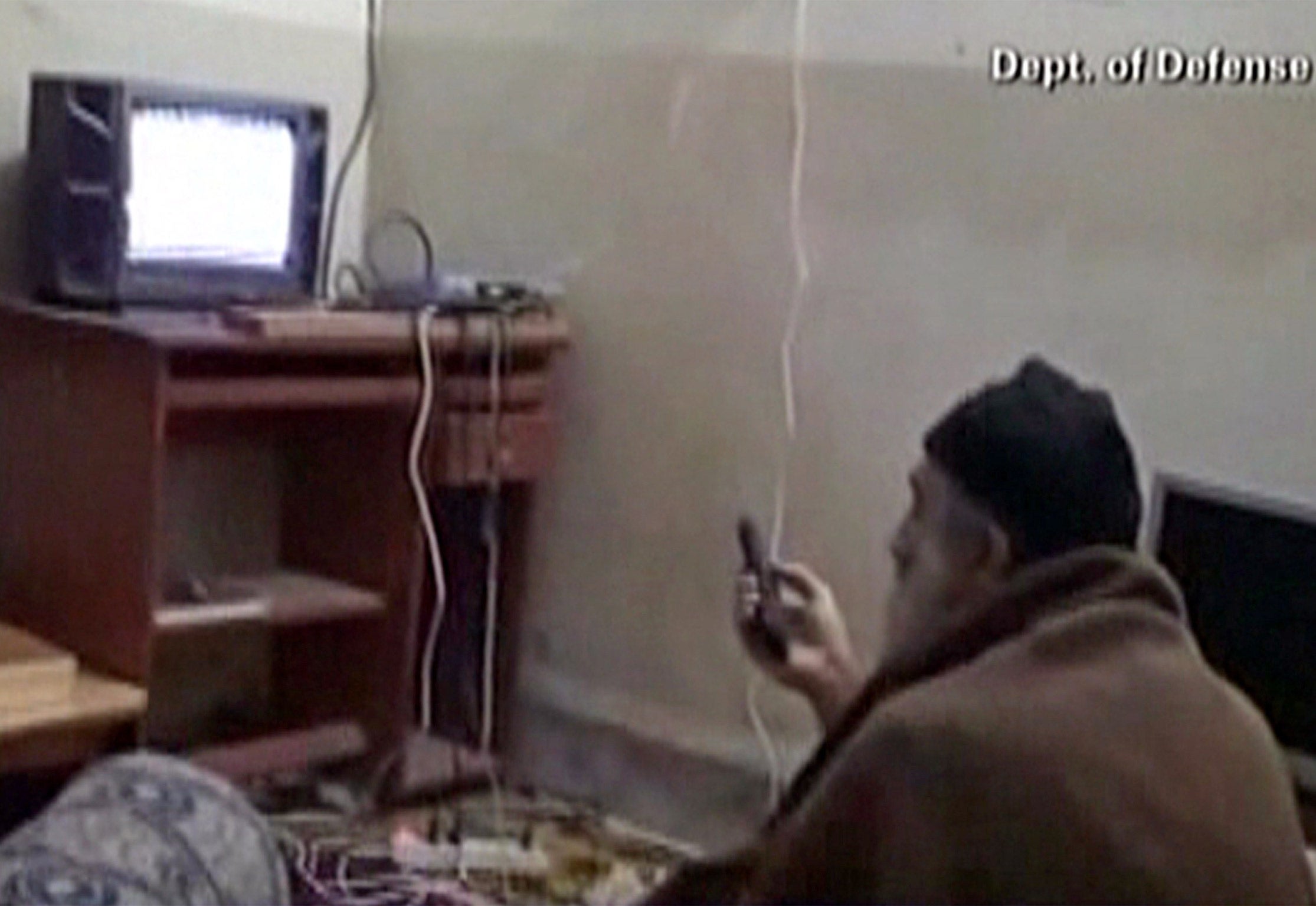 Osama bin Laden watching television at his compound in Abbottabad