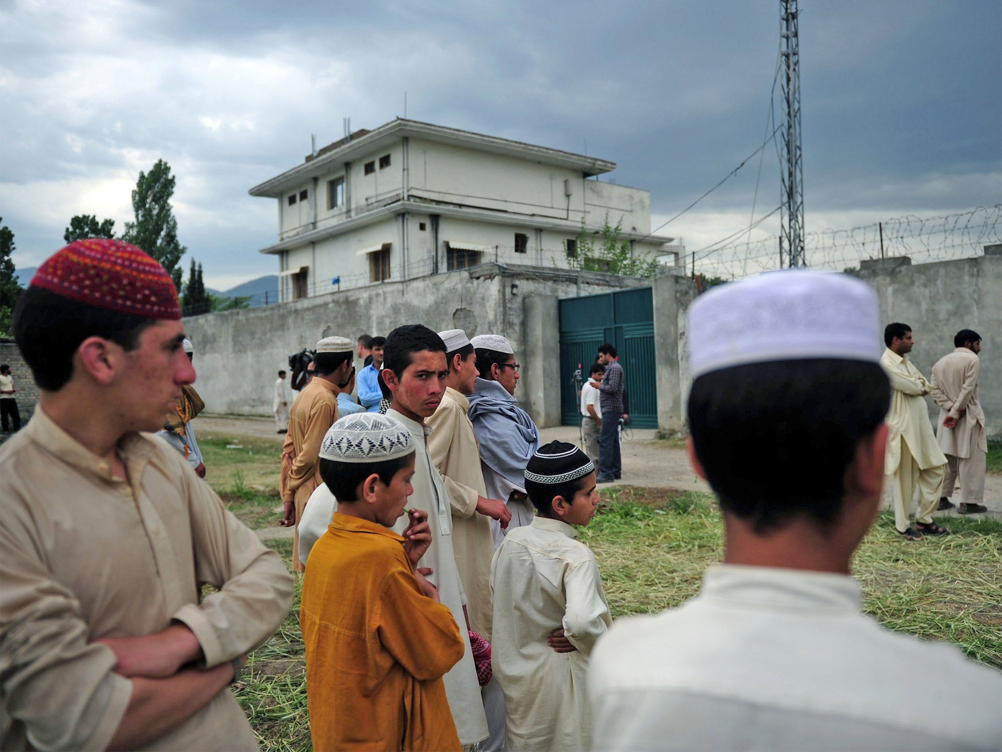 Pakistani seminary students gathering in front of the final hiding place of Osama bin Laden, in Abbottabad, in 2011