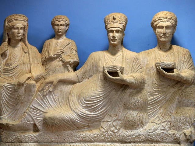 A sculpture depicting a rich family from the ancient Syrian oasis city of Palmyra, displayed at the city's museum