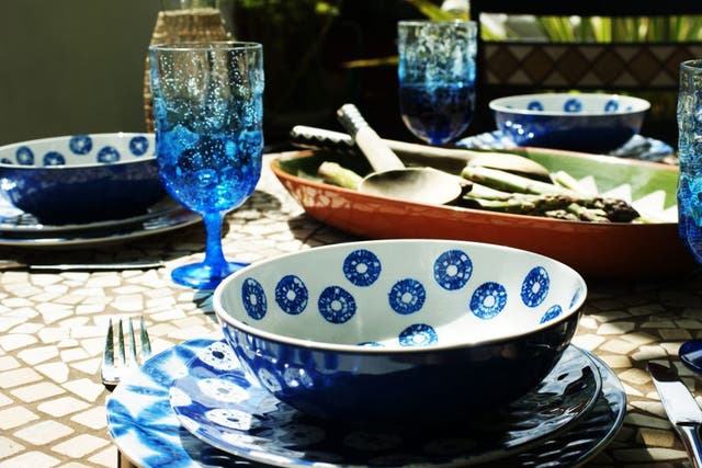The blue and white Indigo range from M&S, with matching wine goblets and the green and terracotta Alvito serving platter from Habitat.