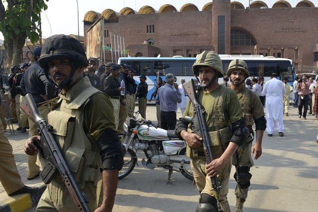 Pakistani Rangers gather for a rehearsal of security arrangements for the Zimbabwe team outside the Gaddafi Cricket Stadium in Lahore