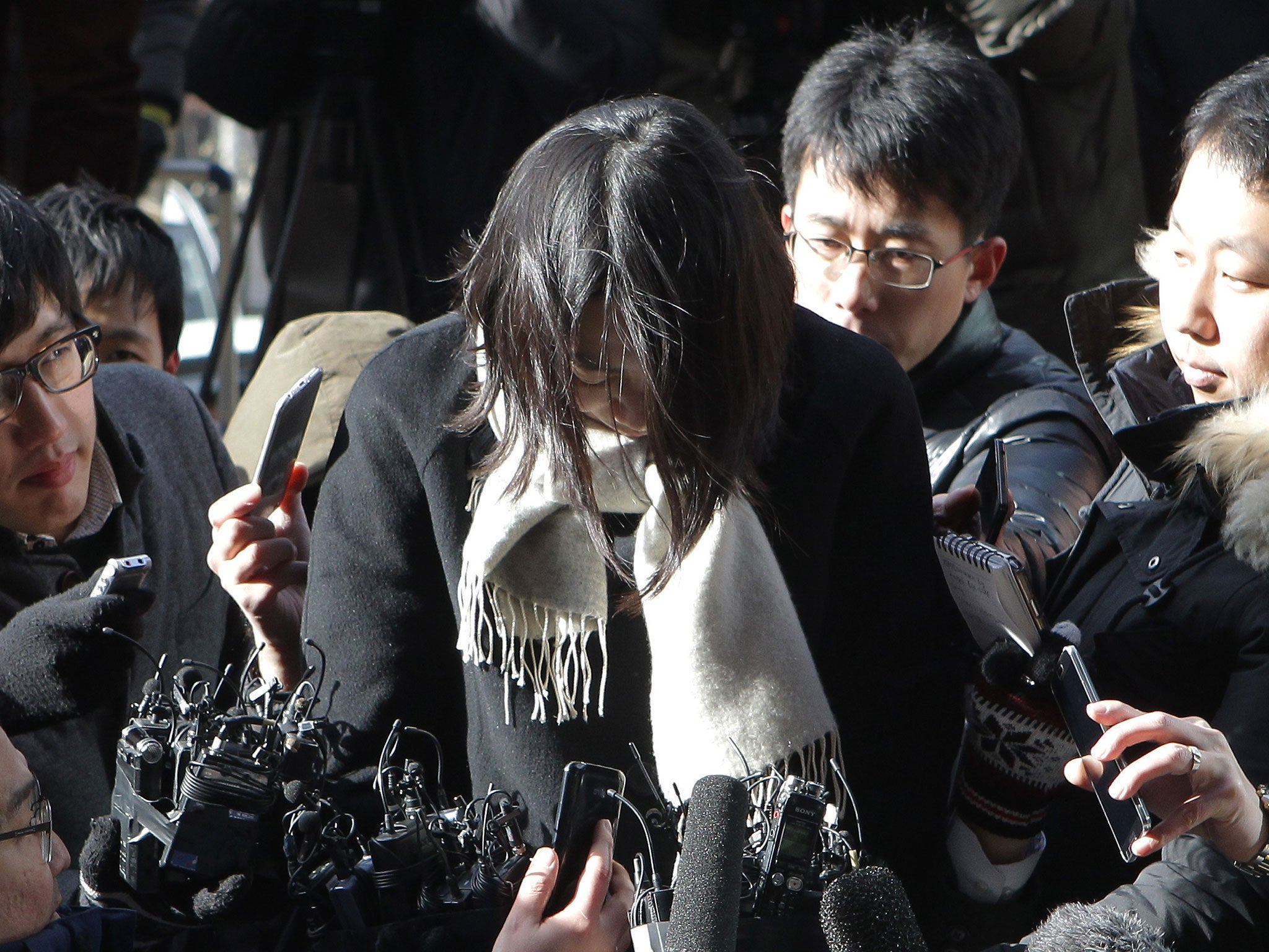 Ms Cho did not stop to speak to reporters after changing out of her prison uniform (credit: Chung Sung-Jun/ Getty)