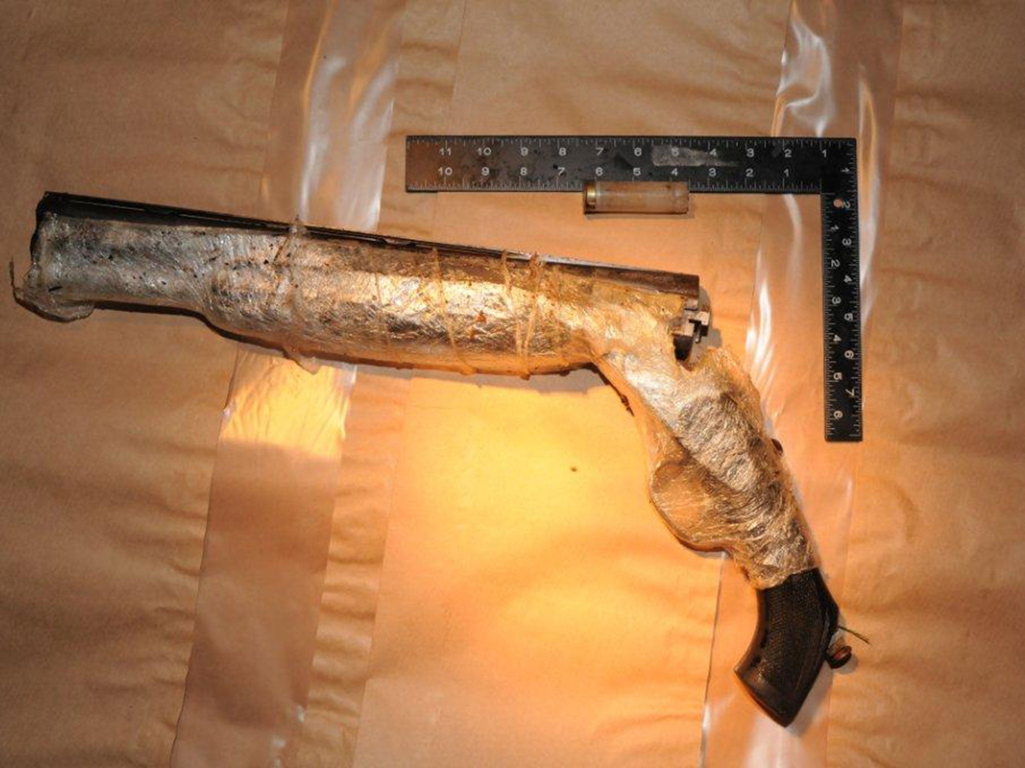 The gun was initially wrapped in Clingfilm with the cartridge still inside (credit: Cheshire Police)