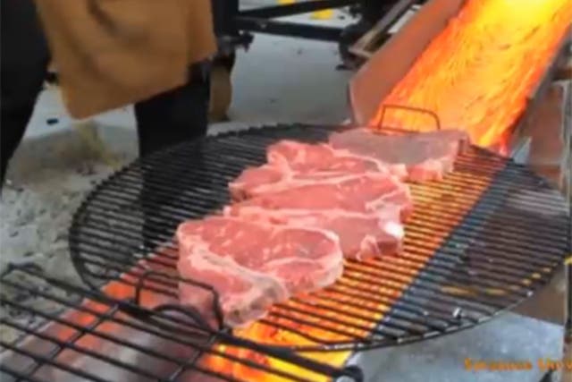 The steaks being grilled by the lava