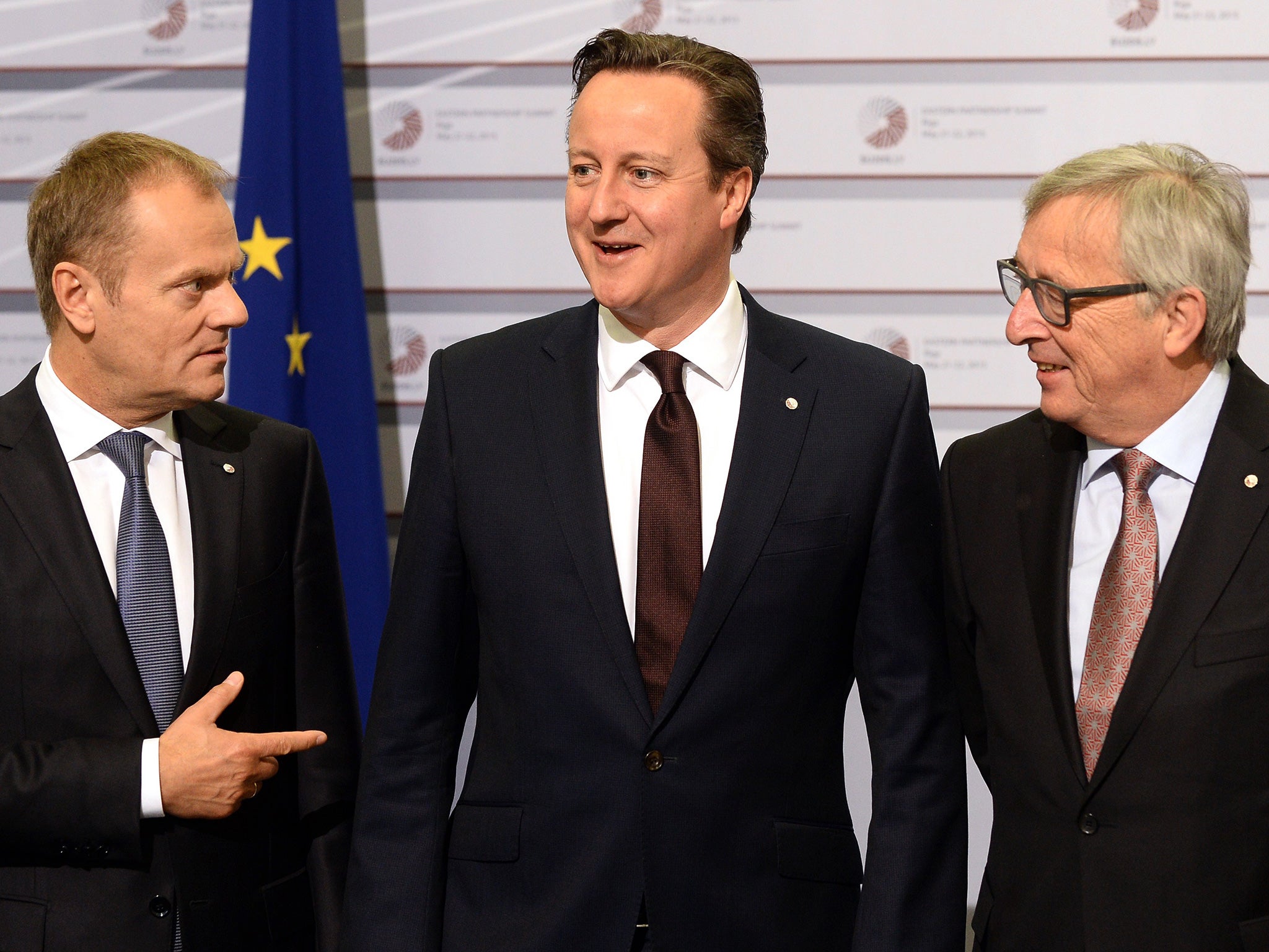Cameron alongside the President of the European Commission Jean-Claude Juncker and President of the European Council Donald Tusk (L)