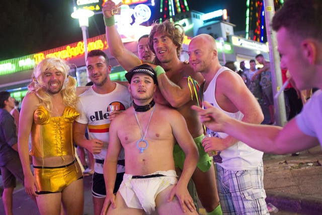 Tourists on a street in Magaluf. Late-night on-street drinking will be banned next week