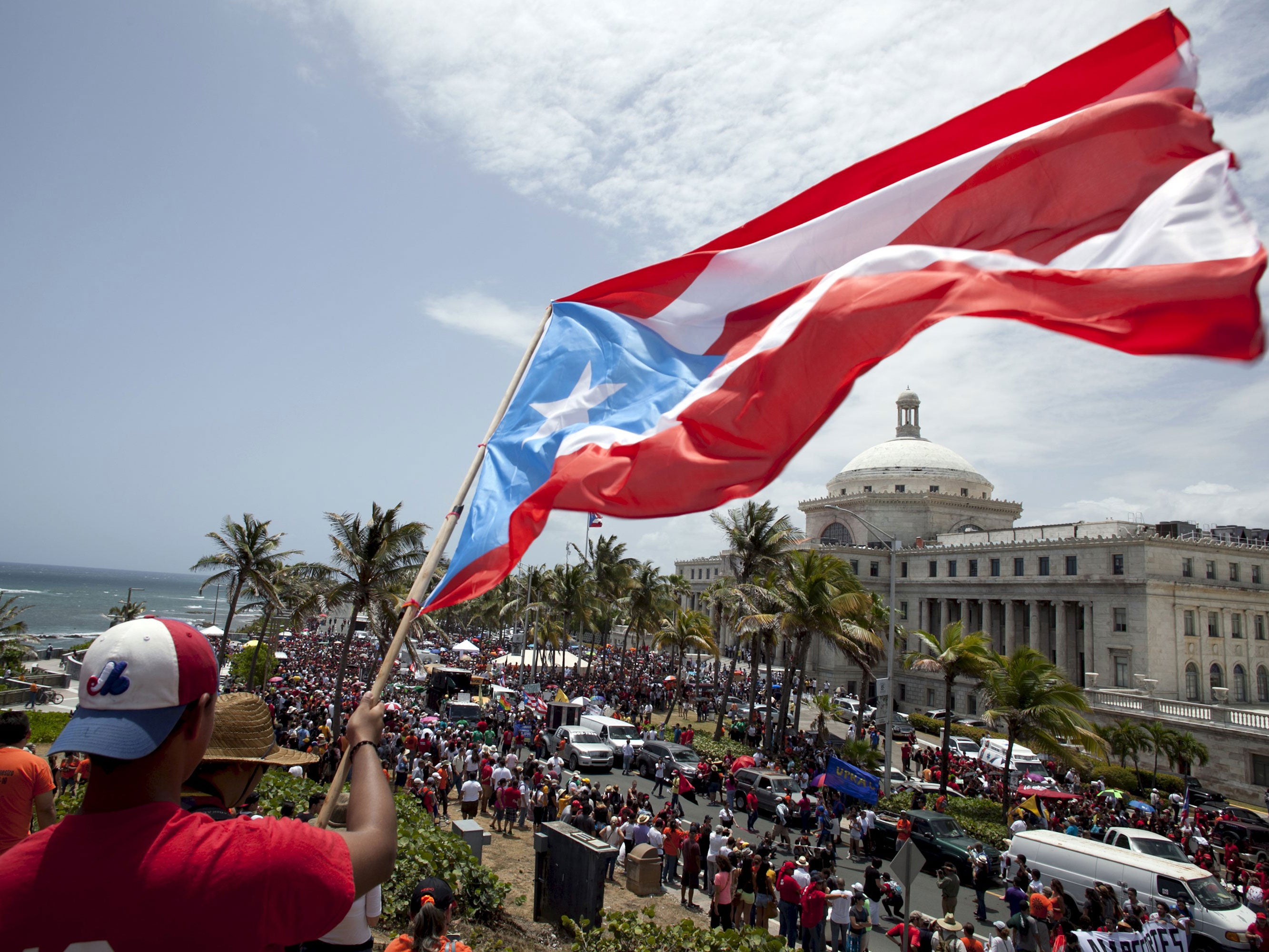 University students and employees protest in San Juan against government plans to implement cuts to university budgets, while many state schools are also under threat