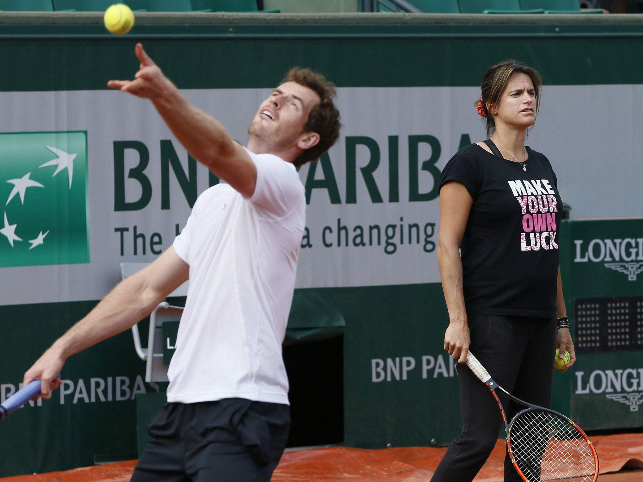 Andy Murray practices alongside his coach Amelie Mauresmo