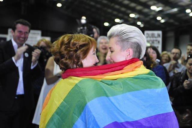 Monnine Griffith and Clodagh Robinson celebrate after early results suggest an overwhelming majority in favour of legalising gay marriage