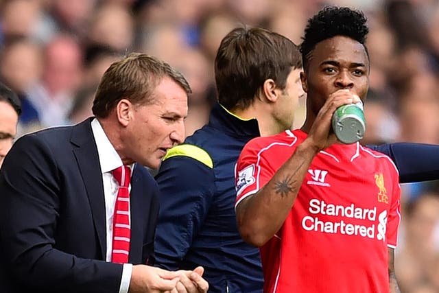 Liverpool manager Brendan Rodgers (left) with Raheem Sterling