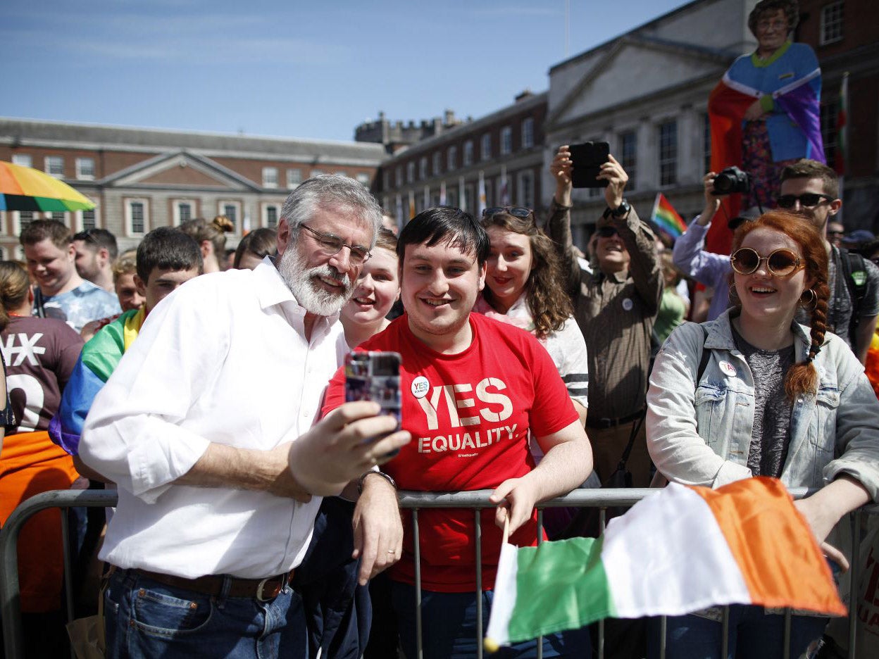 Sinn Fein President Gerry Adams taking selfies with the Yes crowd at Dublin Castle