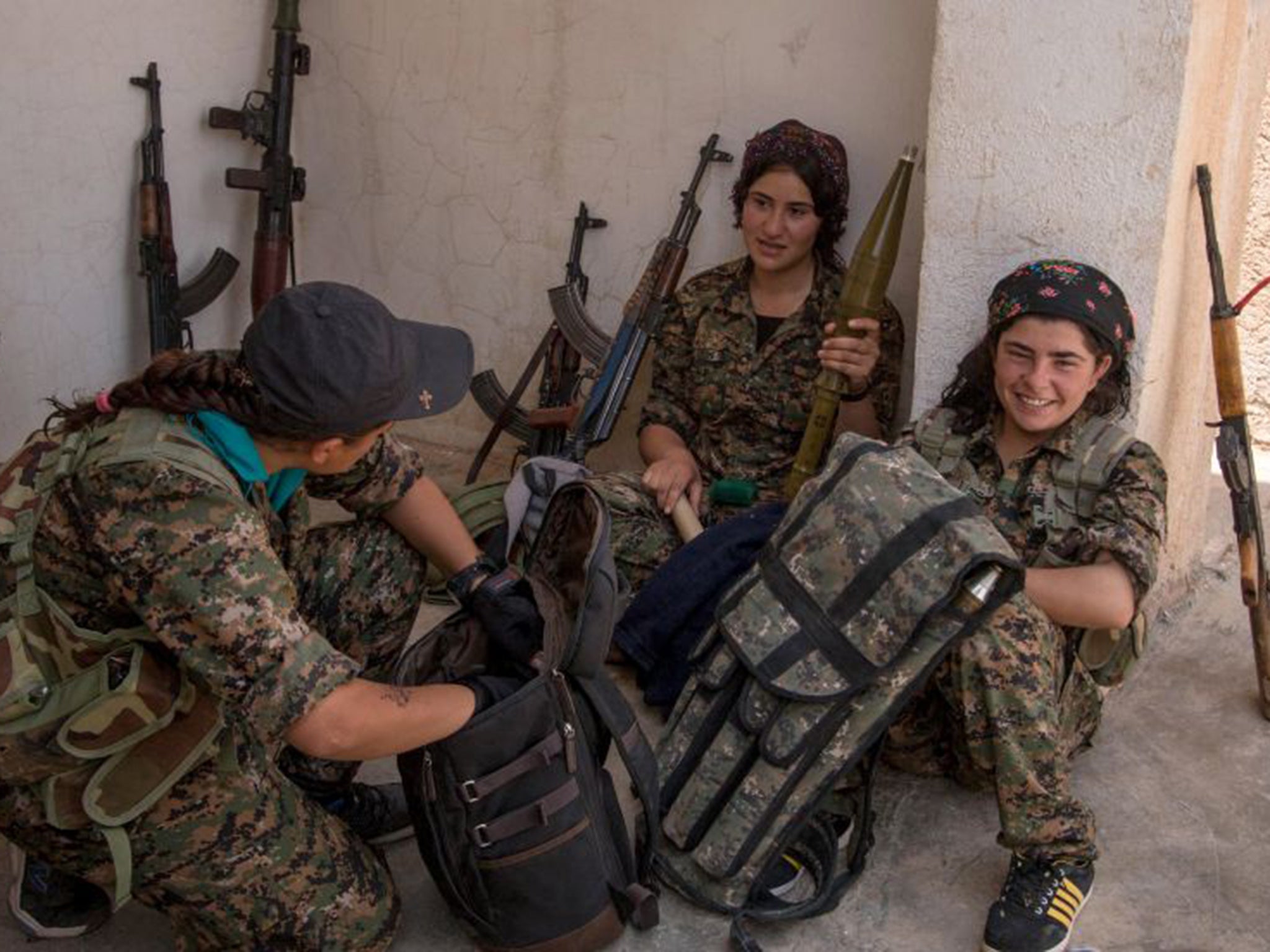 Female Kurdish YPG fighters in the Assyrian village of Tel Nasri after the YPG said it retook control of the area