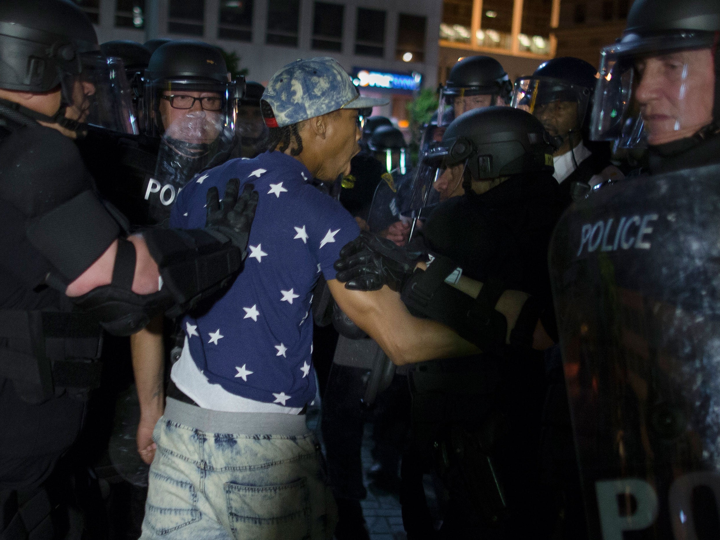 A demonstrator is arrested during a march against the acquittal of Michael Brelo