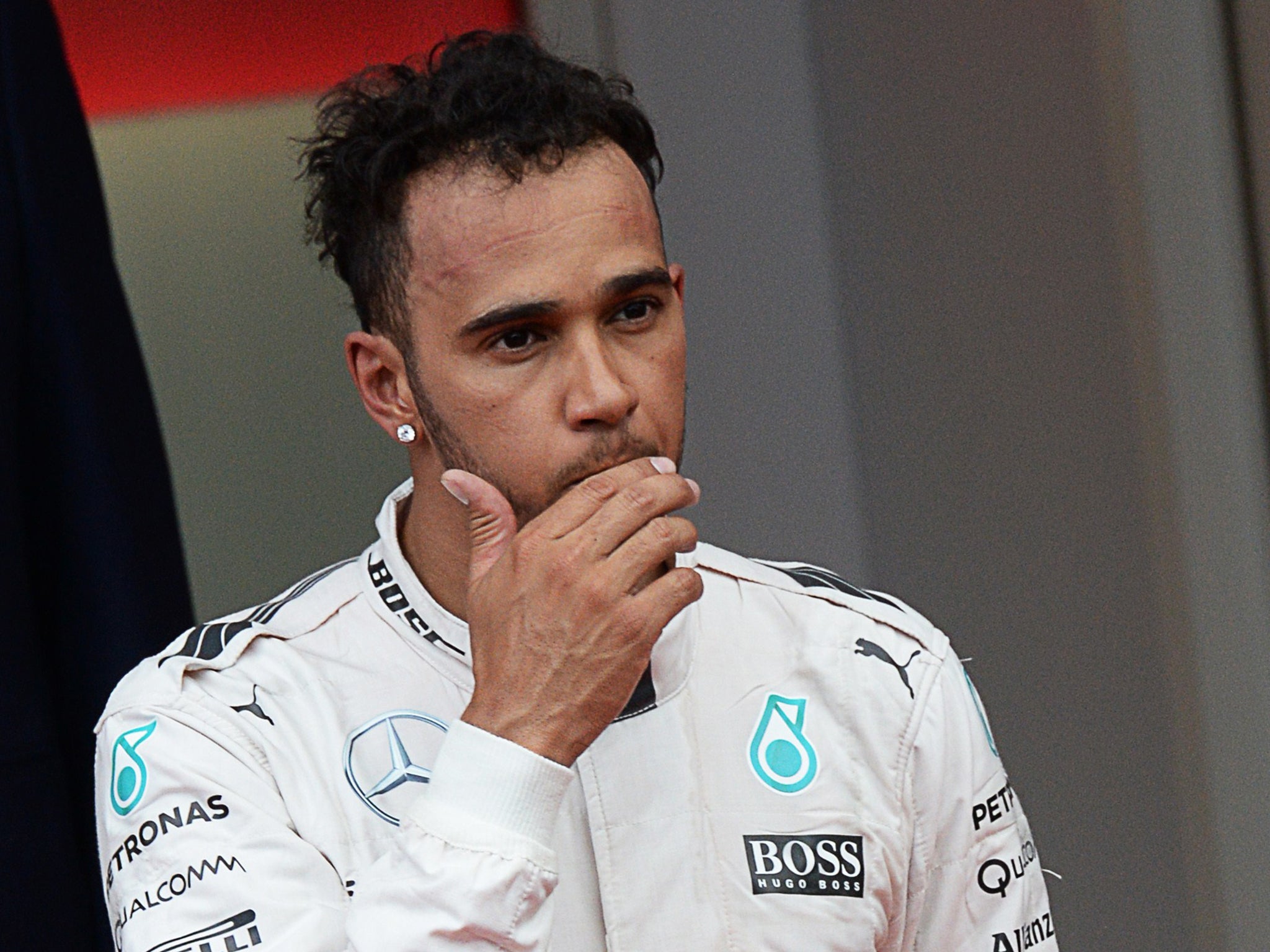 Lewis Hamilton reacts on the podium after the Monaco Grand Prix