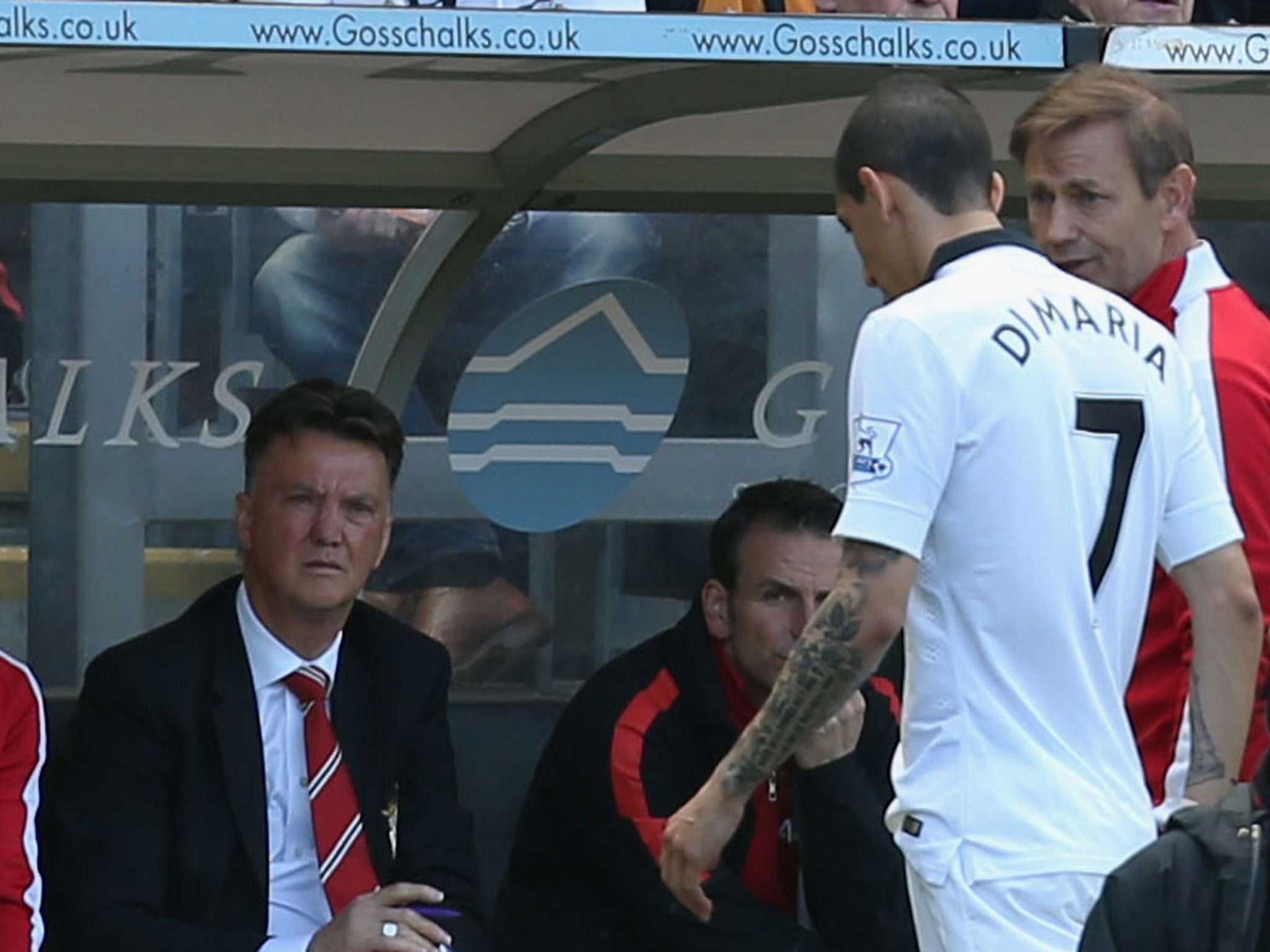 Angel Di Maria comes off on the final day of the season, watched by Louis van Gaal