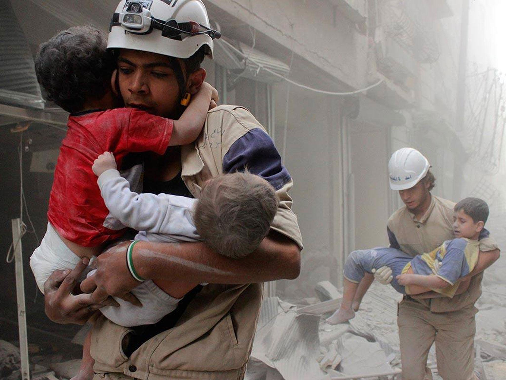 The White Helmets rescue children after an attack. ‘We are here to give hope to people that if they are under the rubble they will not be forgotten’