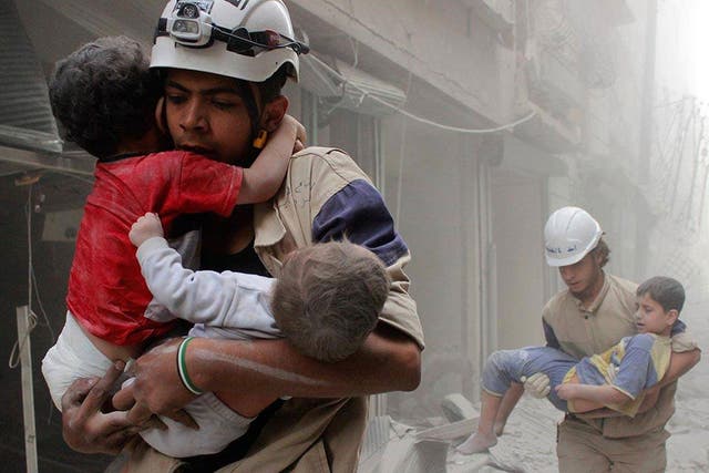 The White Helmets rescue children after an attack. ‘We are here to give hope to people that if they are under the rubble they will not be forgotten’