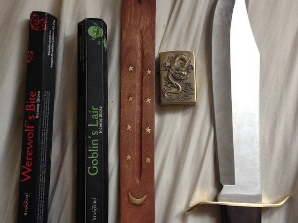 A picture of a knife and incense was posted with the caption "today's purchases"