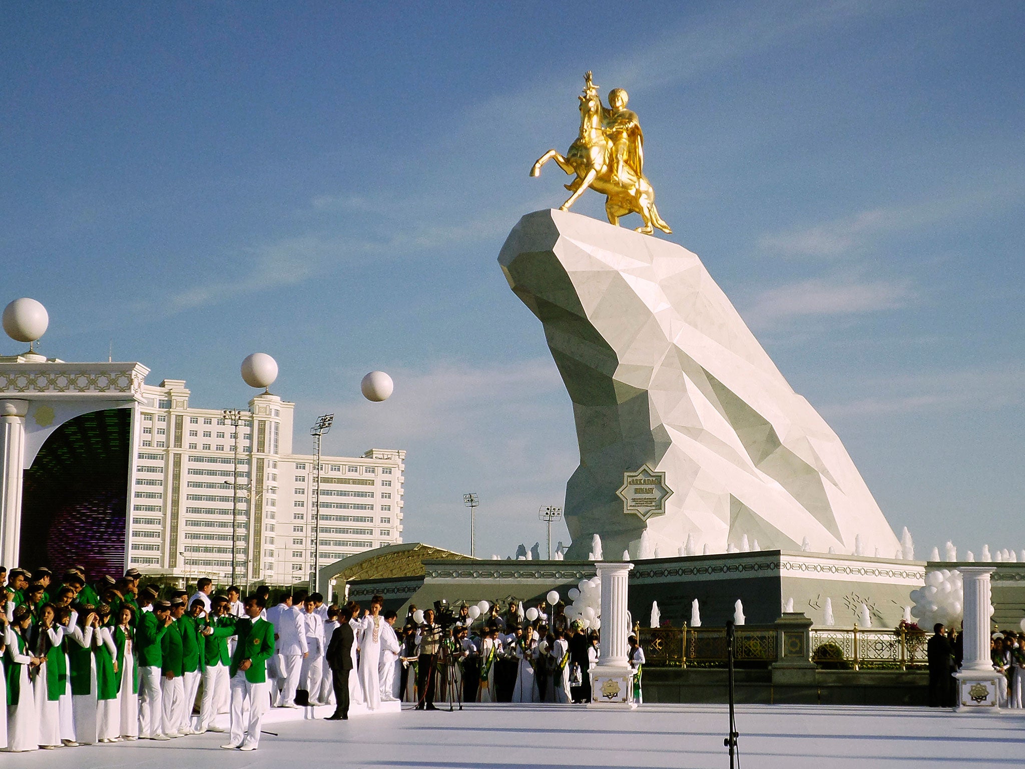 People gather for the unveiling of a monument to President Gurbanguly Berdymukhamedov