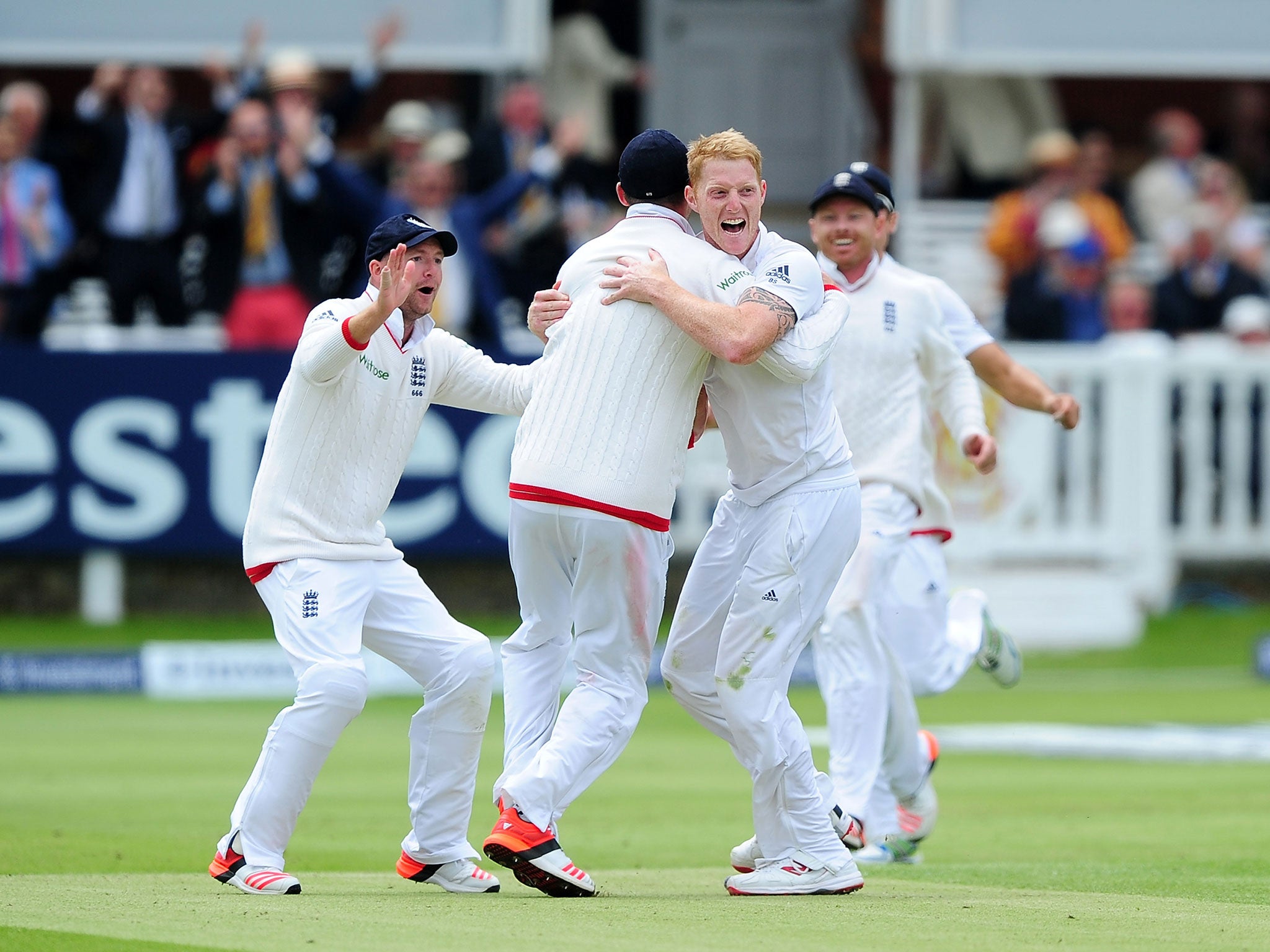 Ben Stokes celebrates with his team mates after bowling Brendon McCullum
