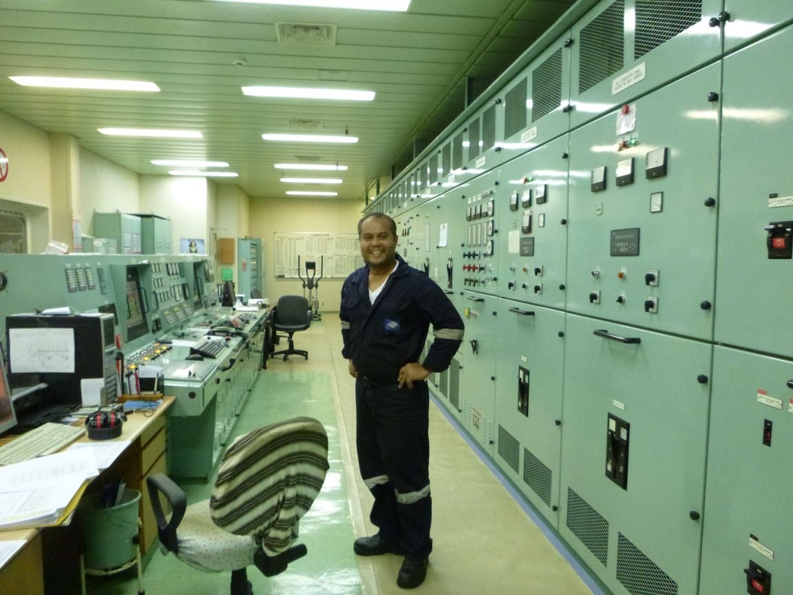 A crew member in the control room