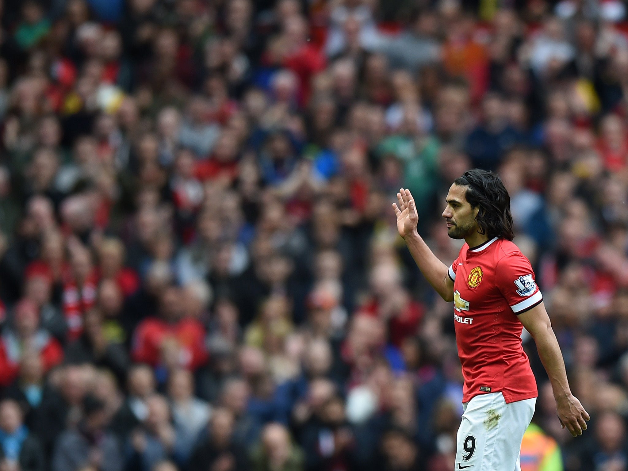 Radamel Falcao waves goodbye to the Manchester United fans