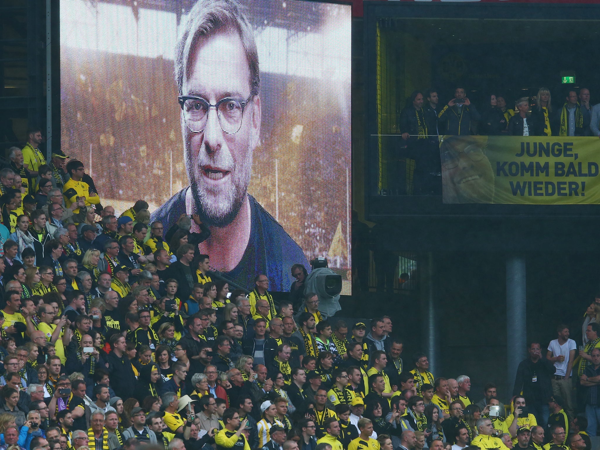 Klopp's message to the fans appears on the big screen