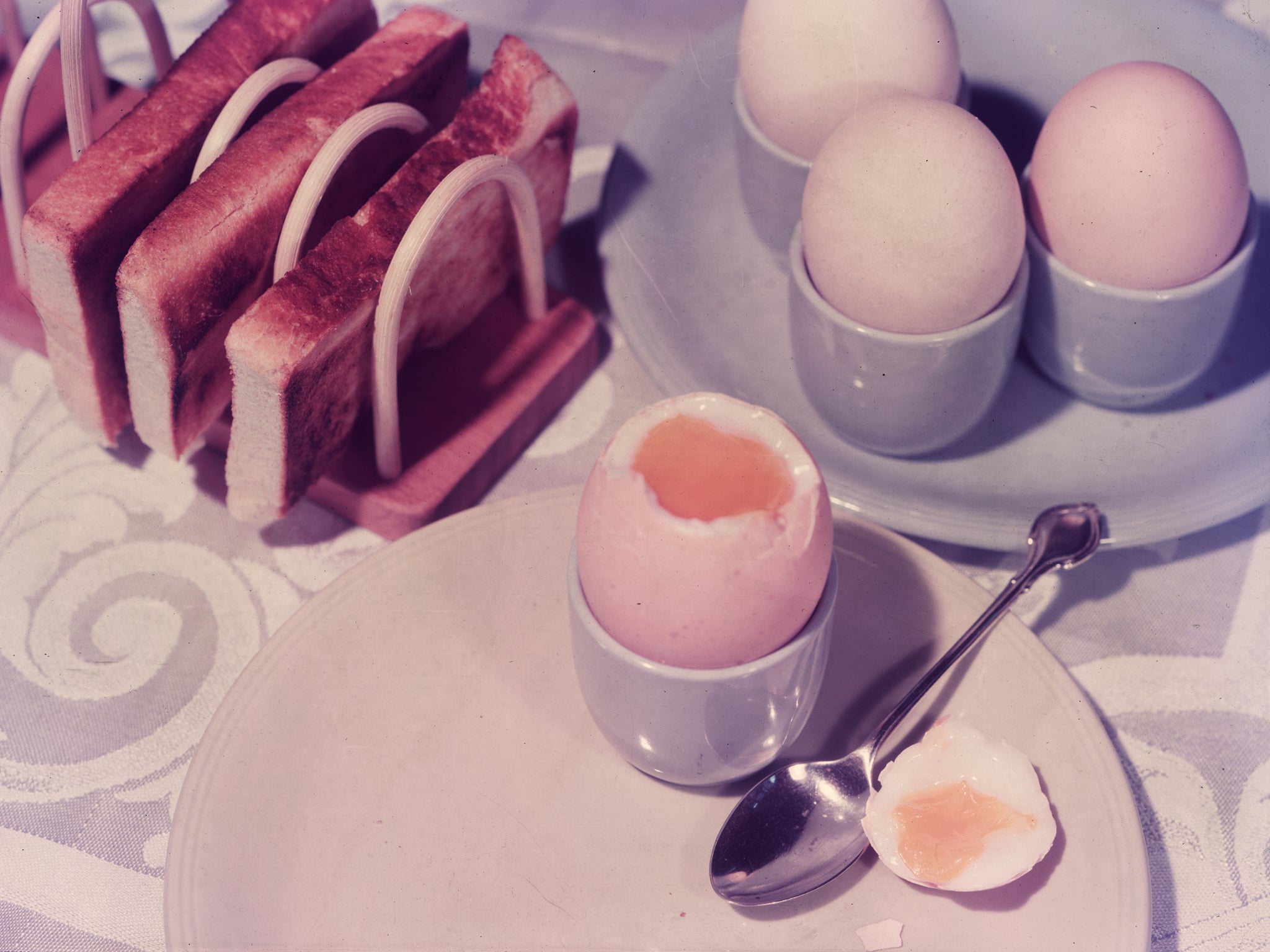 circa 1955: The first meal of the day, boiled eggs and buttered toast for breakfast