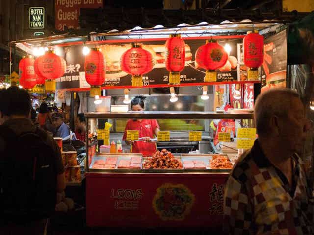 Street smart: a food vendor in Chinatown (Getty)